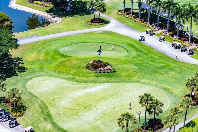 aerial view with view of golf course and a water view