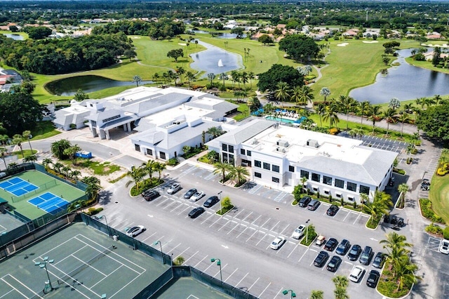 aerial view with a water view and golf course view
