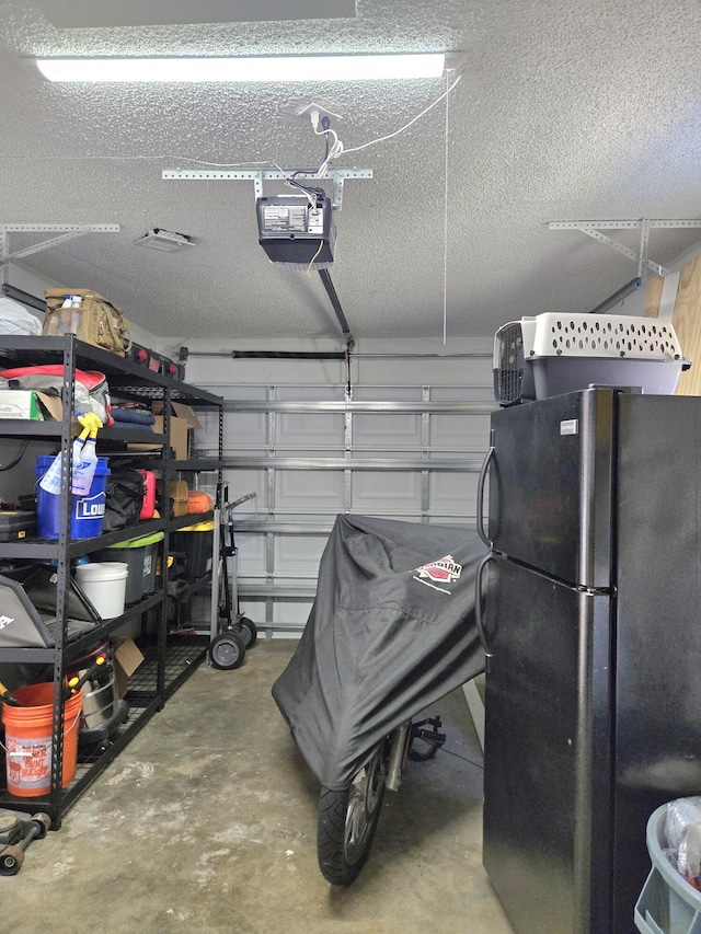 1549 SE Minorca Ave, Port Saint Lucie, FL 34952 - garage featuring a garage door opener and freestanding refrigerator