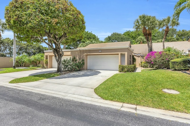 11206 Applegate Cir, Boynton Beach, FL 33437 - ranch-style house featuring concrete driveway, a tile roof, stucco siding, a front lawn, and a garage