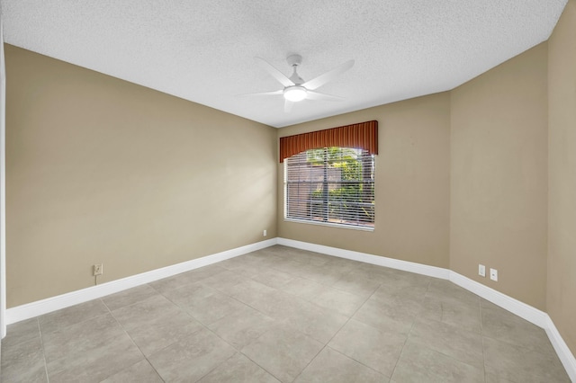11206 Applegate Cir, Boynton Beach, FL 33437 - unfurnished room featuring baseboards, a ceiling fan, a textured ceiling, and light tile patterned flooring
