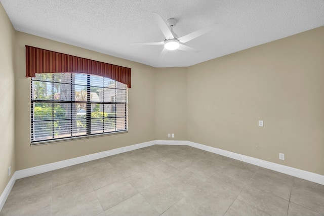 11206 Applegate Cir, Boynton Beach, FL 33437 - spare room featuring a textured ceiling, a ceiling fan, and baseboards