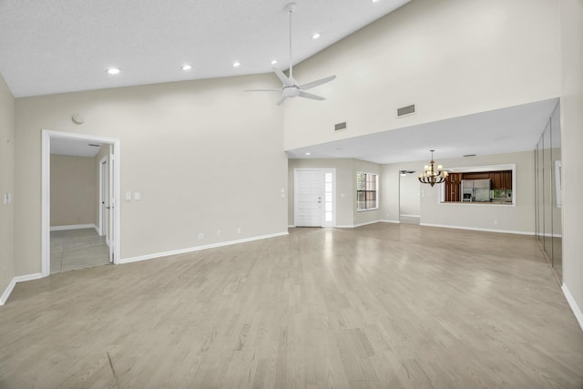 11206 Applegate Cir, Boynton Beach, FL 33437 - unfurnished living room featuring visible vents, light wood-type flooring, baseboards, and ceiling fan with notable chandelier