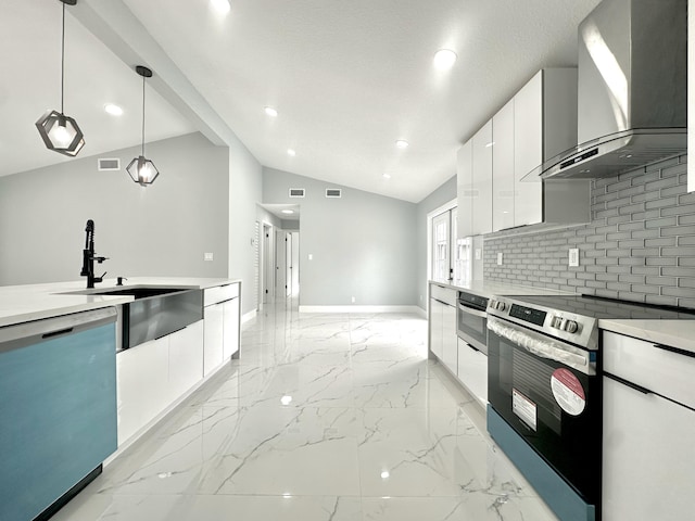 kitchen with marble finish floor, stainless steel appliances, wall chimney range hood, modern cabinets, and a sink