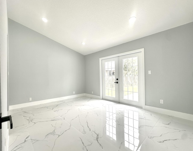 empty room with marble finish floor, baseboards, and french doors