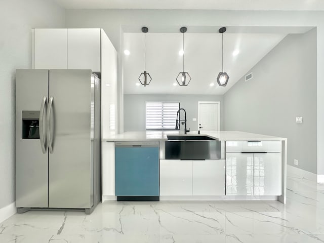 kitchen featuring a sink, stainless steel fridge, dishwasher, marble finish floor, and white cabinetry