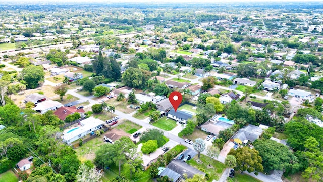 birds eye view of property with a residential view