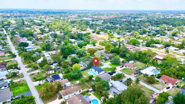 birds eye view of property with a residential view