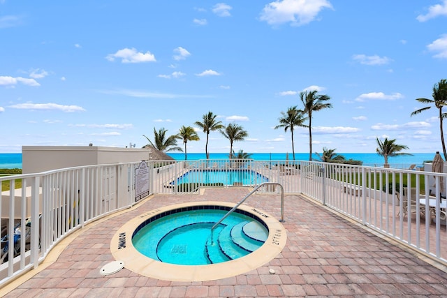 2917 S Ocean Blvd Unit 103, Highland Beach, FL 33487 - pool with a patio, a hot tub, and a water view