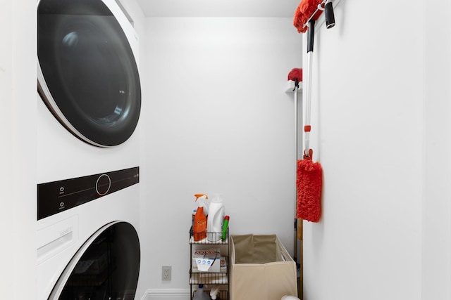 2917 S Ocean Blvd Unit 103, Highland Beach, FL 33487 - laundry area with stacked washer / dryer and laundry area