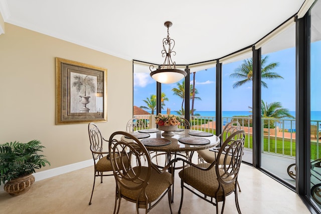2917 S Ocean Blvd Unit 103, Highland Beach, FL 33487 - dining room featuring baseboards, ornamental molding, a water view, and floor to ceiling windows