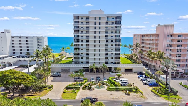 2917 S Ocean Blvd Unit 103, Highland Beach, FL 33487 - view of property with uncovered parking and a water view