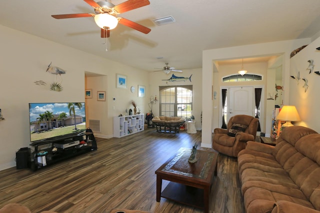 living room featuring baseboards, a ceiling fan, wood finished floors, and visible vents