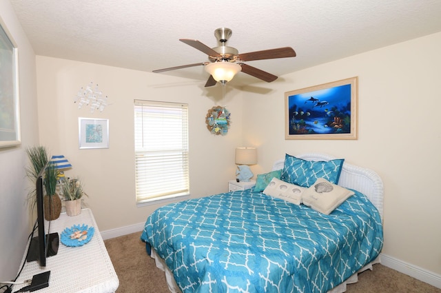 bedroom featuring carpet floors, baseboards, and a ceiling fan