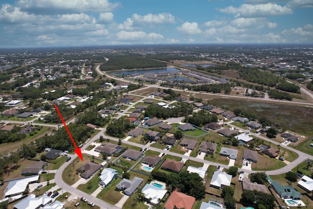 bird's eye view featuring a residential view and a water view