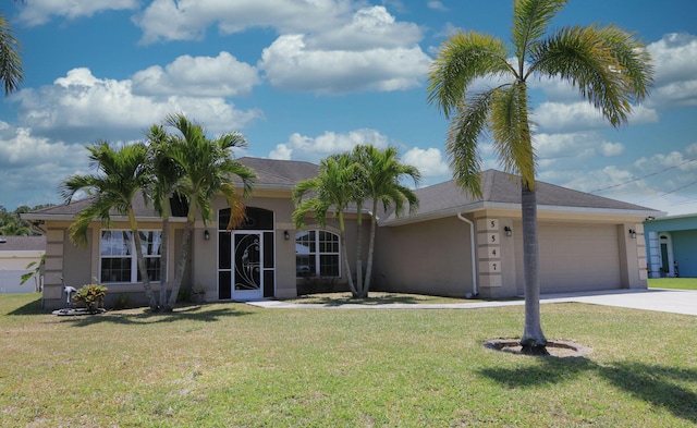 ranch-style house featuring an attached garage, stucco siding, driveway, and a front yard
