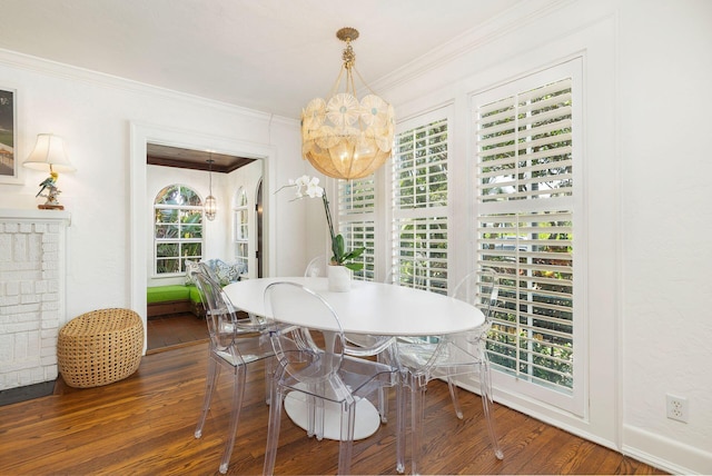 138 Greymon Dr, West Palm Beach, FL 33405 - dining area with ornamental molding, a notable chandelier, and hardwood / wood-style floors