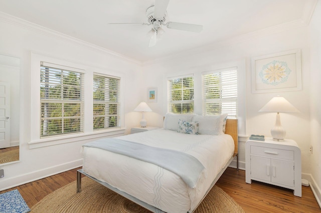 138 Greymon Dr, West Palm Beach, FL 33405 - bedroom featuring crown molding, a ceiling fan, baseboards, and wood finished floors