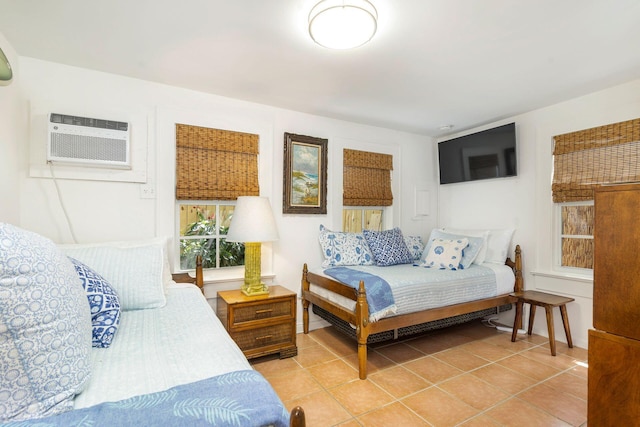 138 Greymon Dr, West Palm Beach, FL 33405 - bedroom with light tile patterned floors and a wall mounted AC