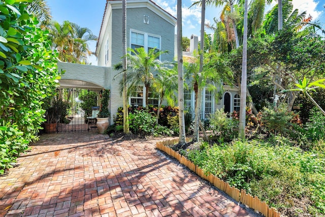 138 Greymon Dr, West Palm Beach, FL 33405 - view of front of home with fence, a gate, and stucco siding