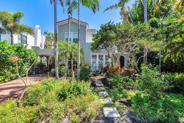 138 Greymon Dr, West Palm Beach, FL 33405 - rear view of house featuring stucco siding