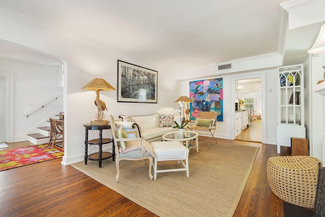 138 Greymon Dr, West Palm Beach, FL 33405 - living room with visible vents, ornamental molding, wood finished floors, baseboards, and stairway
