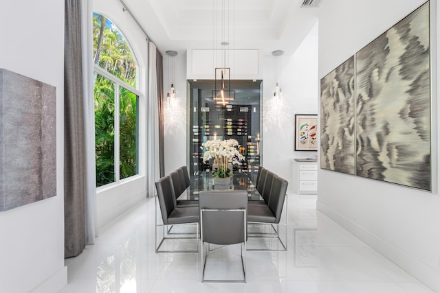 5784 Vintage Oaks Cir, Delray Beach, FL 33484 - tiled dining space featuring visible vents, a raised ceiling, and a wealth of natural light