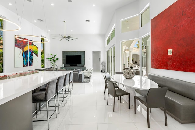 5784 Vintage Oaks Cir, Delray Beach, FL 33484 - dining room with recessed lighting, light tile patterned floors, and a high ceiling