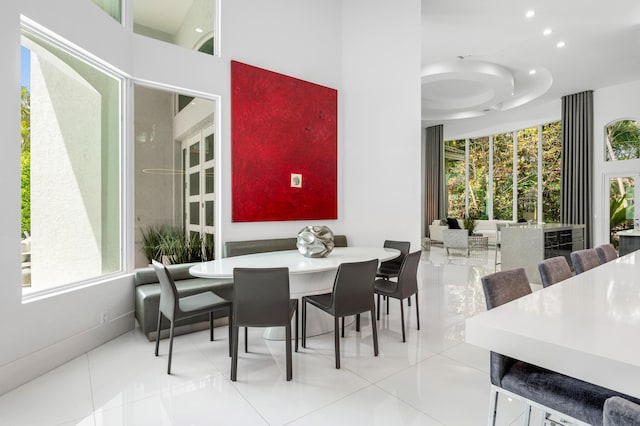 5784 Vintage Oaks Cir, Delray Beach, FL 33484 - tiled dining space with baseboards, recessed lighting, and a high ceiling
