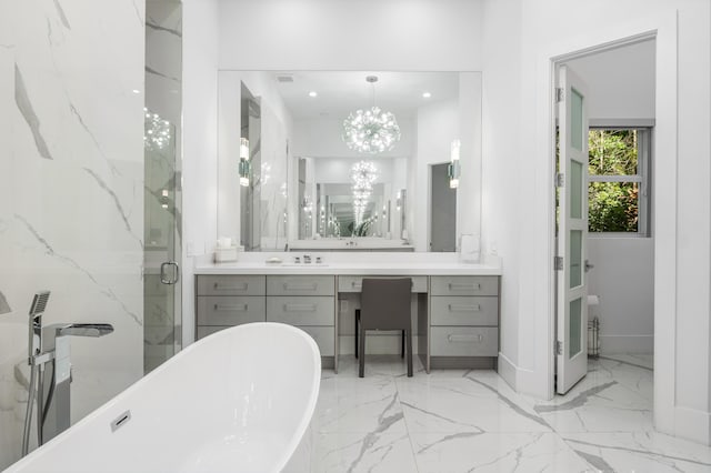 5784 Vintage Oaks Cir, Delray Beach, FL 33484 - bathroom featuring a chandelier, marble finish floor, vanity, a soaking tub, and a marble finish shower