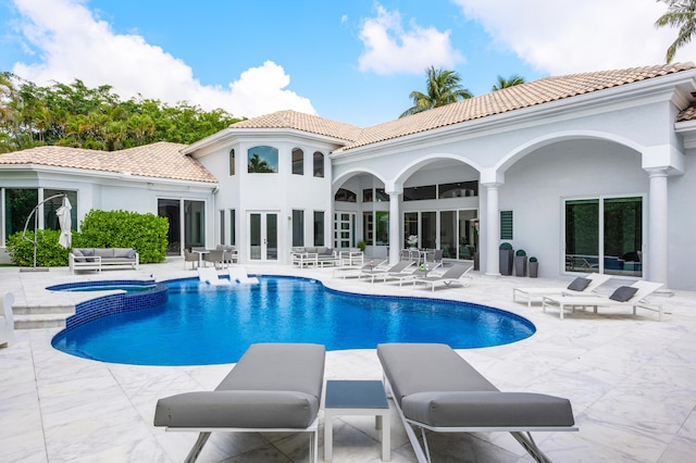 5784 Vintage Oaks Cir, Delray Beach, FL 33484 - view of swimming pool with a patio, an outdoor living space, french doors, and a pool with connected hot tub