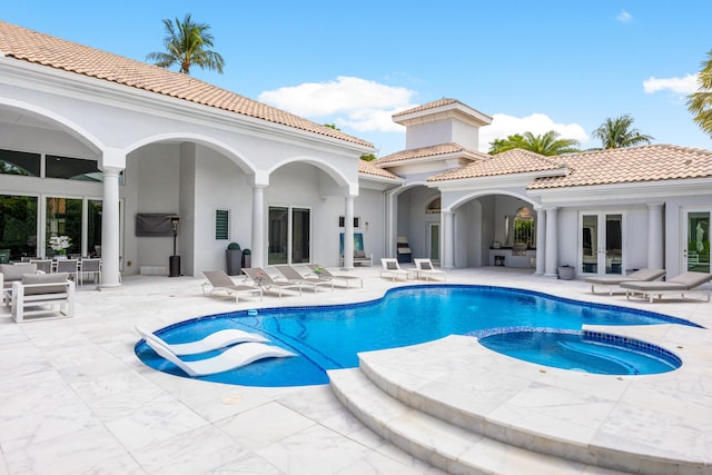 5784 Vintage Oaks Cir, Delray Beach, FL 33484 - view of pool featuring a pool with connected hot tub, an outdoor hangout area, french doors, and a patio area