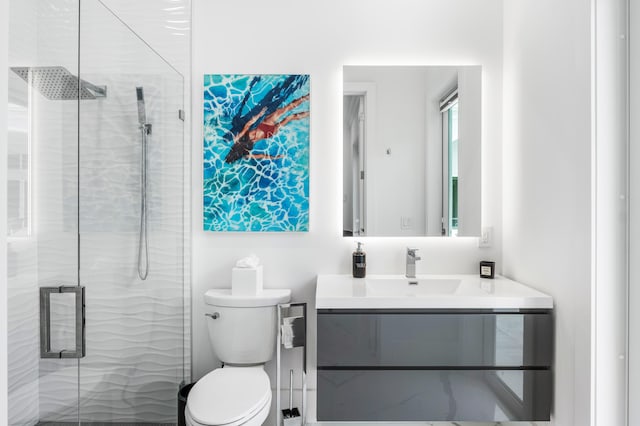 5784 Vintage Oaks Cir, Delray Beach, FL 33484 - bathroom featuring toilet, vanity, and a stall shower