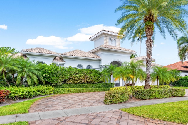 5784 Vintage Oaks Cir, Delray Beach, FL 33484 - mediterranean / spanish-style home with stucco siding and a tiled roof