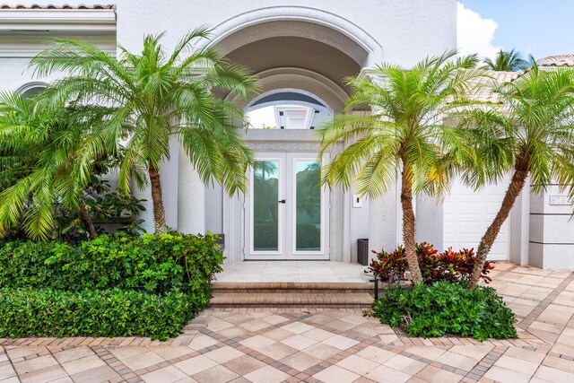 5784 Vintage Oaks Cir, Delray Beach, FL 33484 - entrance to property featuring stucco siding and french doors