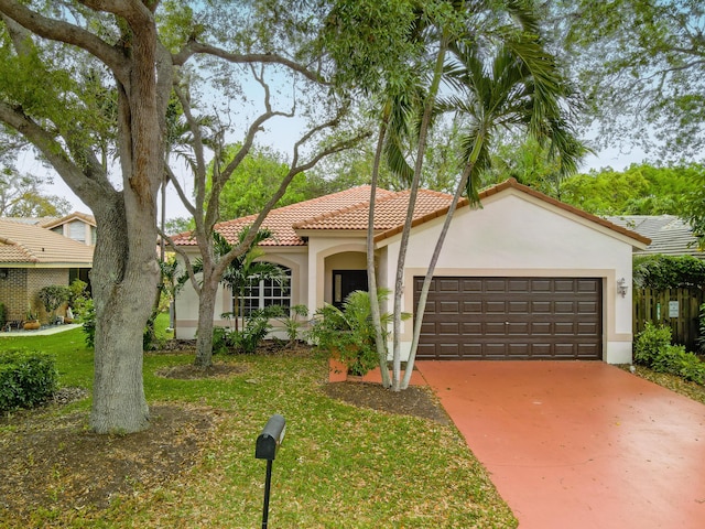 4155 NW 1st Ct, Delray Beach, FL 33445 - mediterranean / spanish house featuring a tiled roof, stucco siding, an attached garage, concrete driveway, and a front lawn