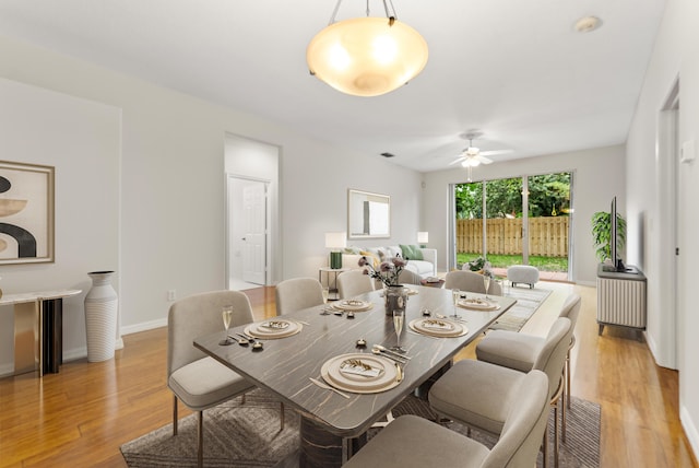 4155 NW 1st Ct, Delray Beach, FL 33445 - dining room with light wood-type flooring, ceiling fan, and baseboards