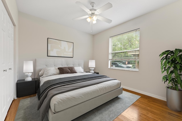 4155 NW 1st Ct, Delray Beach, FL 33445 - bedroom with baseboards, wood finished floors, a closet, and a ceiling fan