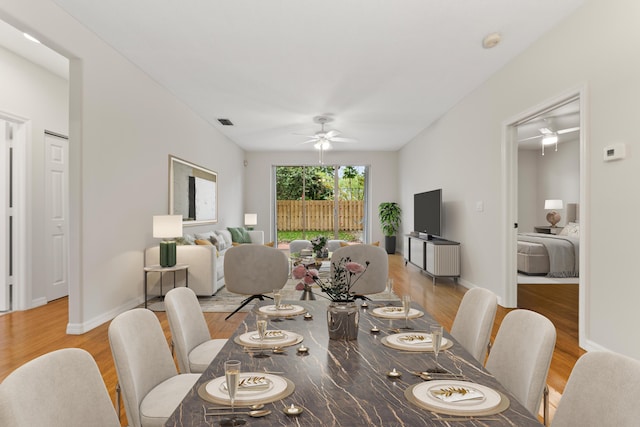 4155 NW 1st Ct, Delray Beach, FL 33445 - dining room with ceiling fan, light wood-style flooring, and baseboards