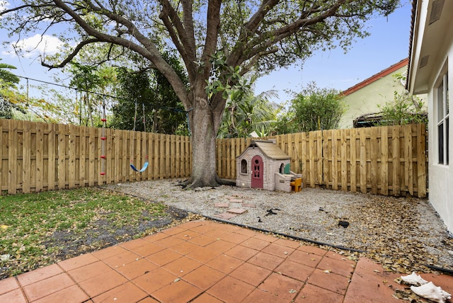 4155 NW 1st Ct, Delray Beach, FL 33445 - view of patio featuring a fenced backyard