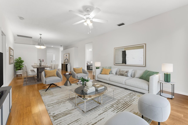 4155 NW 1st Ct, Delray Beach, FL 33445 - living area with light wood-type flooring, ceiling fan, and baseboards