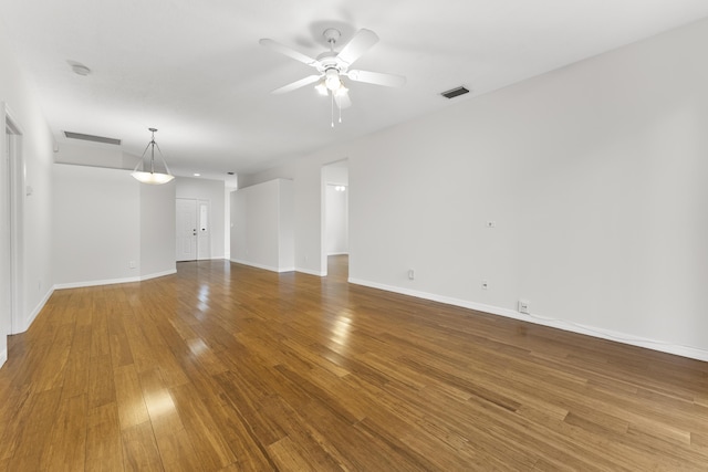 4155 NW 1st Ct, Delray Beach, FL 33445 - empty room with wood finished floors, a ceiling fan, baseboards, and a smoke detector