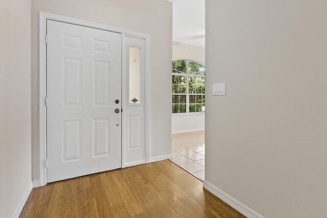4155 NW 1st Ct, Delray Beach, FL 33445 - foyer featuring baseboards and wood finished floors