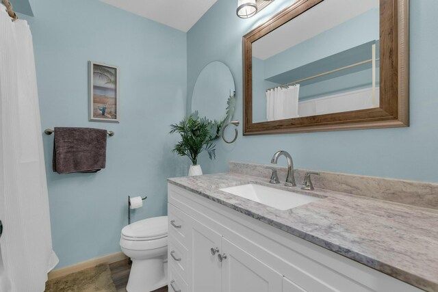 bathroom with vanity and toilet