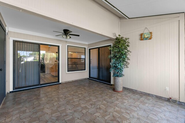 doorway to property with a patio and ceiling fan
