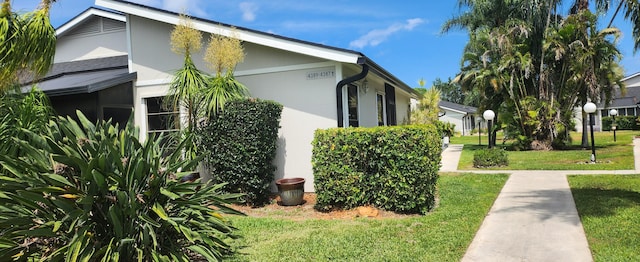 4389 Willow Pond Cir, West Palm Beach, FL 33417 - view of home's exterior featuring stucco siding and a yard