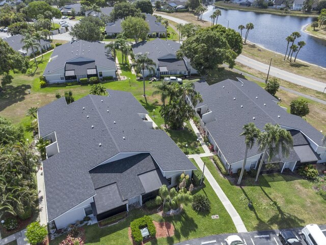aerial view featuring a residential view and a water view