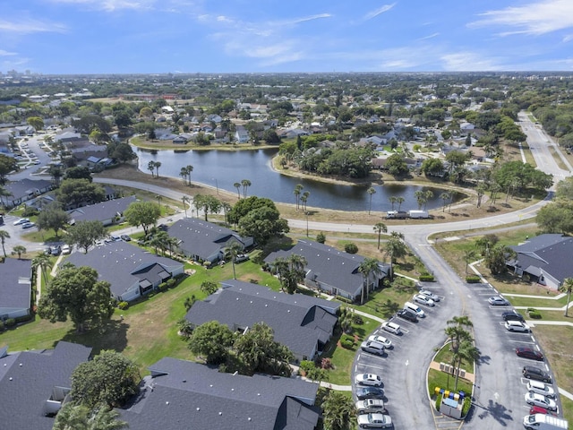 birds eye view of property with a water view and a residential view