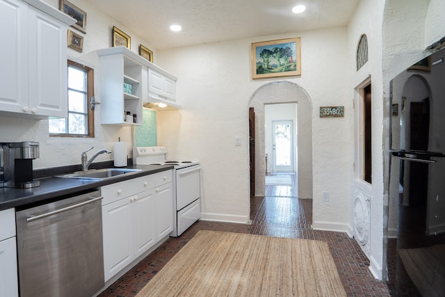 kitchen with dishwasher, a sink, freestanding refrigerator, white electric range oven, and a textured wall