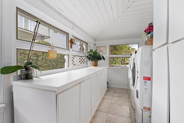 laundry room featuring washing machine and dryer and cabinet space